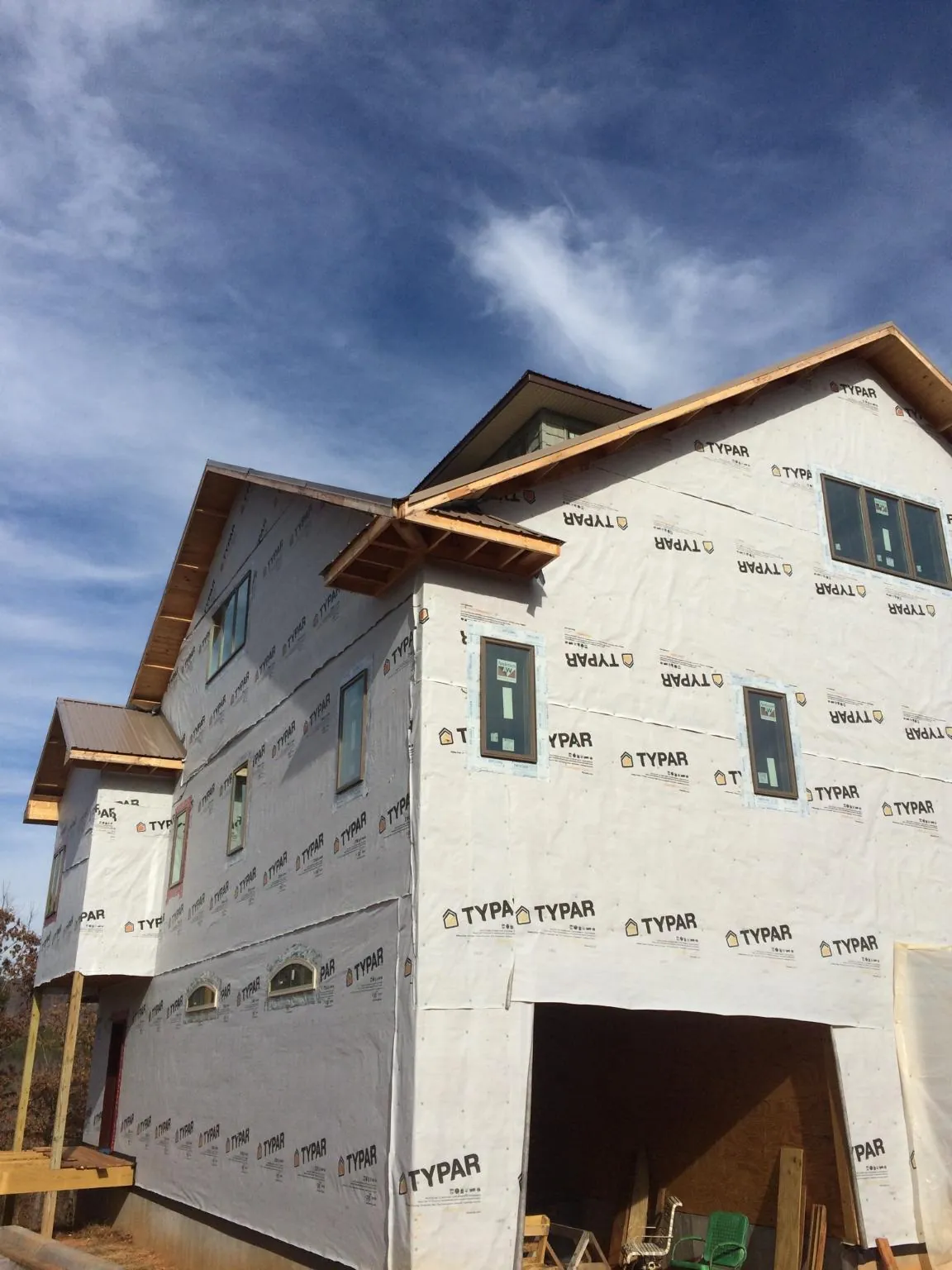 Stick built house wrapped in Typar with new roof framing and dormers in Newkirk